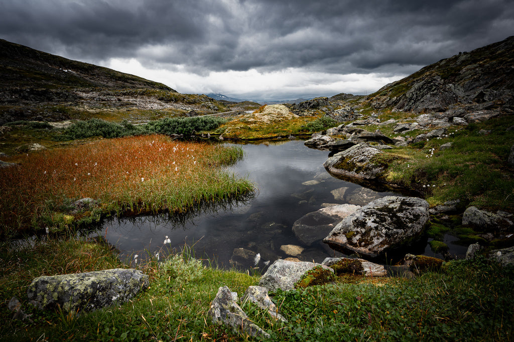 Norway storm landscape with dark clouds over reflective pond – Hollow fine art print.
